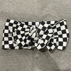 Baby bling checkered bow. Never worn.